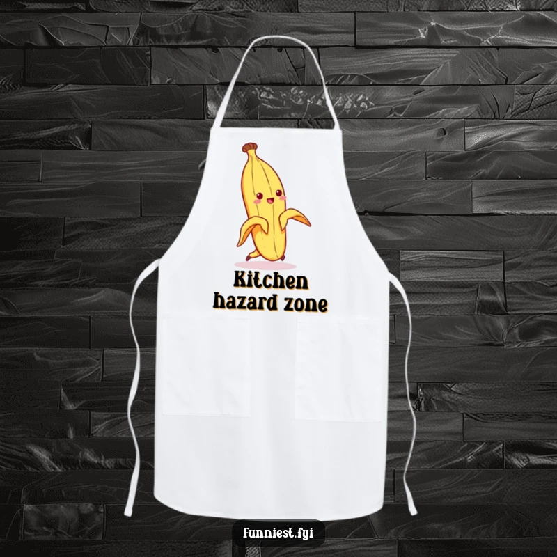Funny apron showing a banana peel character comically slipping on its own peel while in a kitchen setting, a humorous scene.