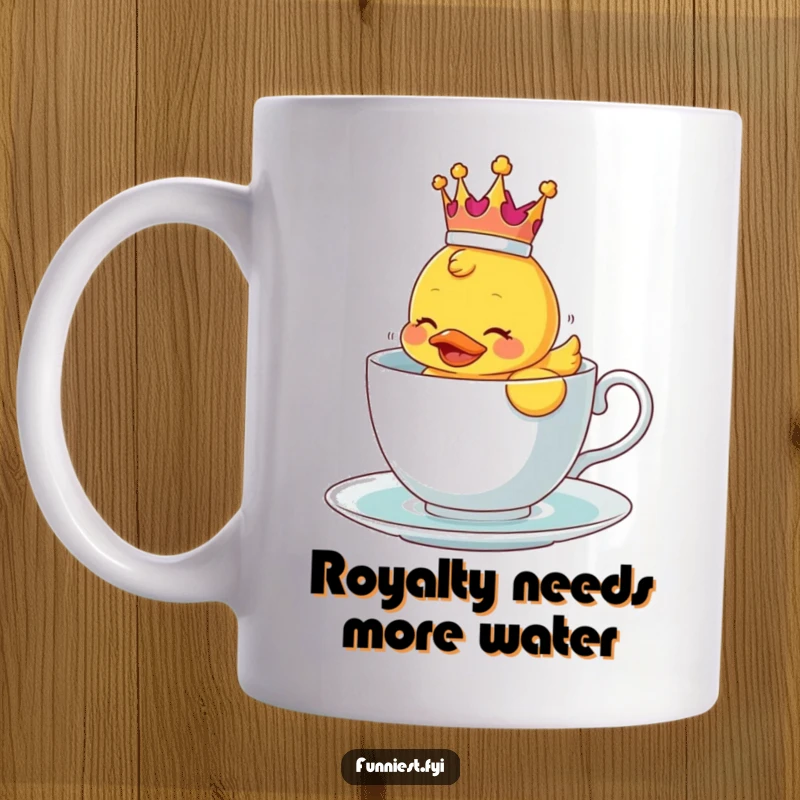 Funny mug showing a rubber ducky with a crown struggling to float in a small teacup.
