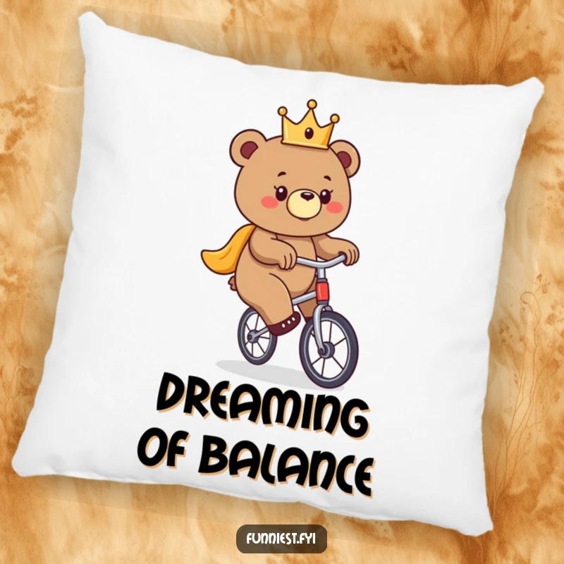 Funny bear pillow, a crowned bear precariously balancing on a unicycle, adding humorous comfort.