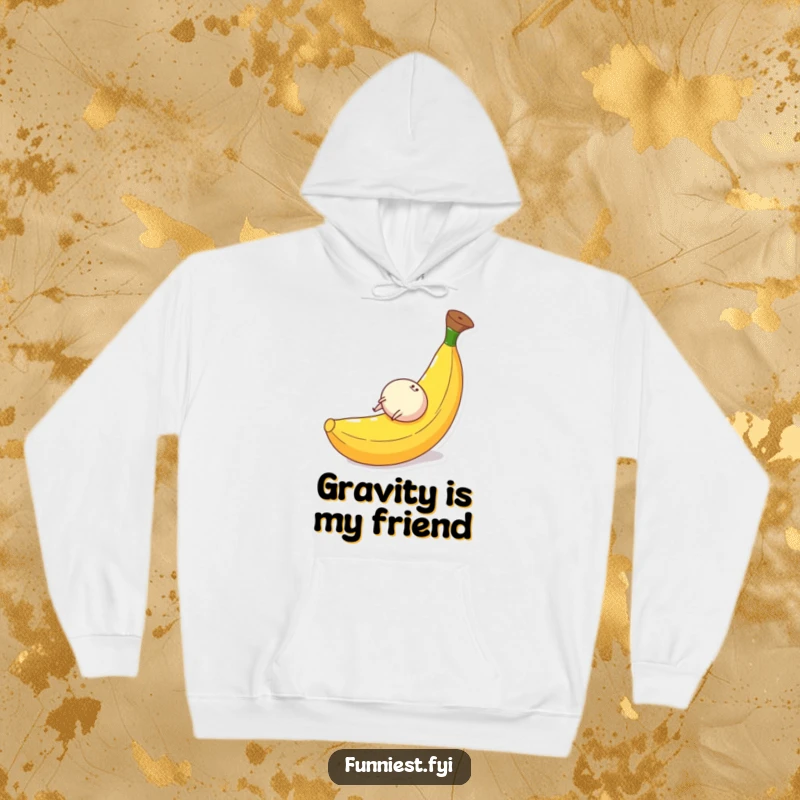 Funny hoodie depicting a round character with tiny legs gleefully tumbling down a huge banana peel, perfect for cozy, comical moments.