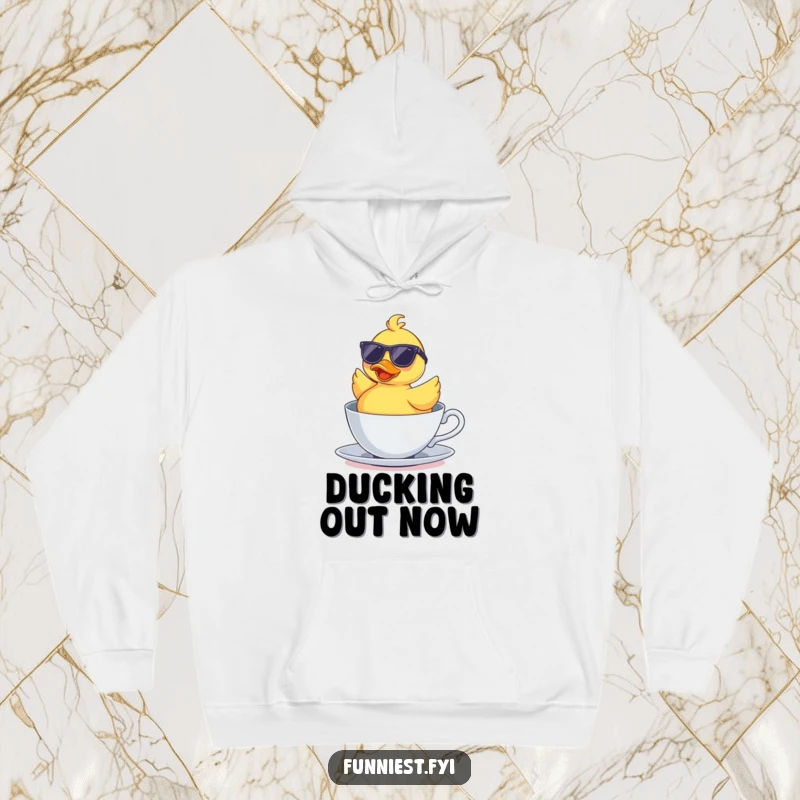 Funny hoodie featuring a rubber duck sporting sunglasses, floating upside down in a teacup, radiating supreme, humorous relaxation.