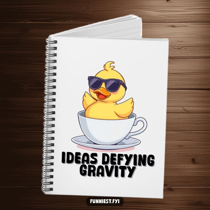 Funny notebook with a rubber duck wearing sunglasses floating upside down in a teacup, encouraging humorous note-taking and ideas.