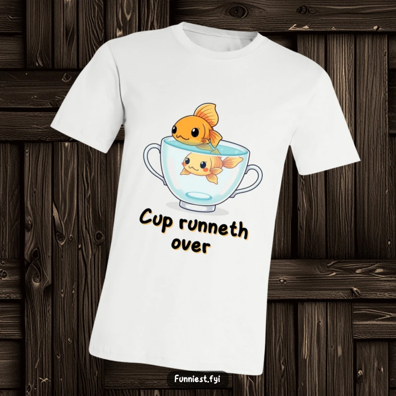 Funny determined goldfish character swimming in a giant teacup, a humorous t-shirt for those with big goals.