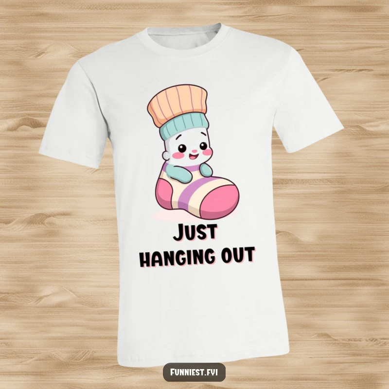 Funny t-shirt depicting a small, giggling sock peeking out from the pocket of a larger, mismatched sock, radiating pure joy.