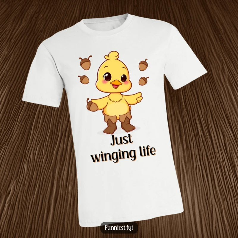 A funny, happy duck character sporting oversized boots and skillfully juggling acorns on this delightful t-shirt.